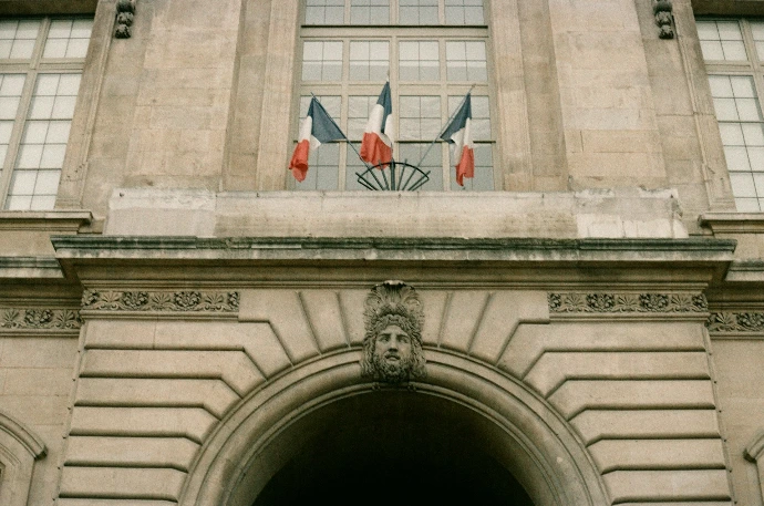 A very tall building with a clock on it's side